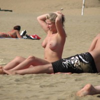 Pierced Nipples Voyeured On Beach - Big Tits, Blonde Hair, Large Breasts, Long Hair, Navel Piercing, Pierced Nipples, Topless Beach, Beach Tits, Beach Voyeur