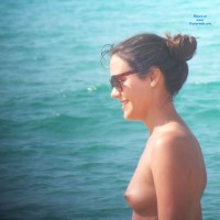 Smiling And Topless In Beach - Brunette Hair, Exposed In Public, Firm Tits, Hard Nipple, Nipples, Nude In Nature, Nude In Public, Showing Tits, Small Tits, Sunglasses, Topless Beach, Topless Girl, Topless Outdoors, Topless, Water, Beach Tits, Beach Voyeur, Sexy Face, Sexy Woman, Young Woman