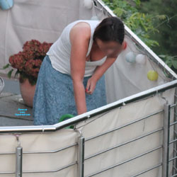 Pic #1Neighbour Pour Her Flowers! - Big Tits, Voyeur