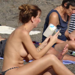 Pic #4 Reading Topless On The Beach - Big Tits, Outdoors, Beach Voyeur