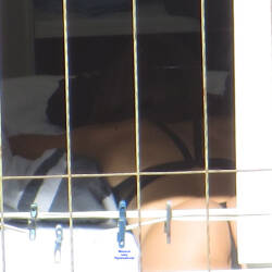 Pic #3 Pussy Slip Sunbathing Home - Voyeur