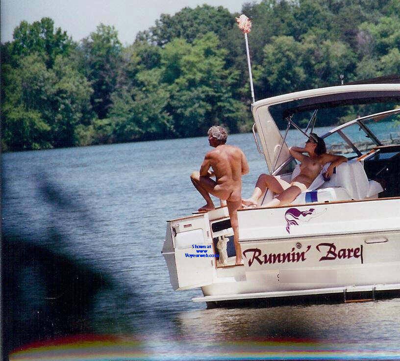nude boating , Was Out Walking Through The Woods Around The Lake A Few Years Ago And Was Licky Enough To Get These Pics Of A Couple Nude On Their Boat! Even One Of The Woman Squatted Down Peeing