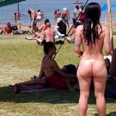 Brunette naked at public beach