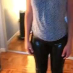 My wife stripping off  her black latex pants