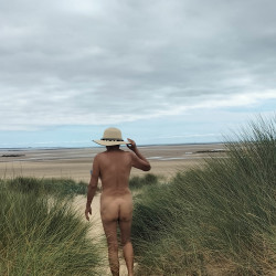 Walking nude by the beach