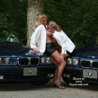 Erotic Pose In Front Of Two BMW - Black Hair, Blonde Hair